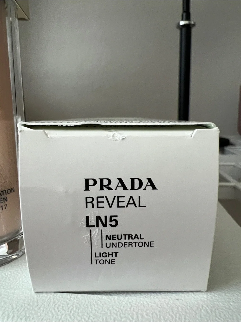 Prada Reveal Foundation LN5 - Light Beige with Gold Accent